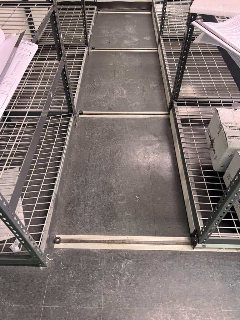 Mobile storage shelving unit tracks