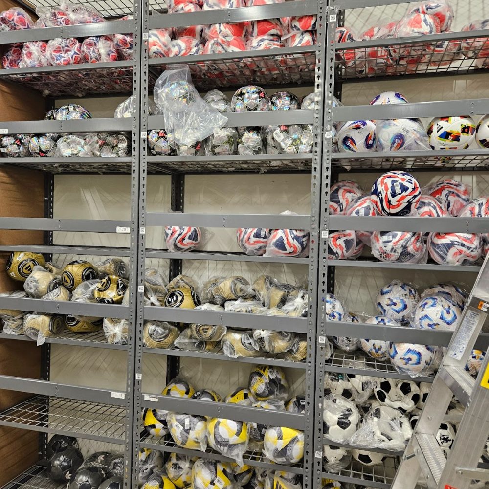 Soccer balls sporting equipment on pipp racks backroom storage